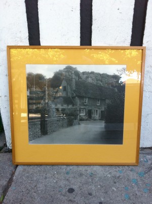 framed black & white photograph of old brick houses
