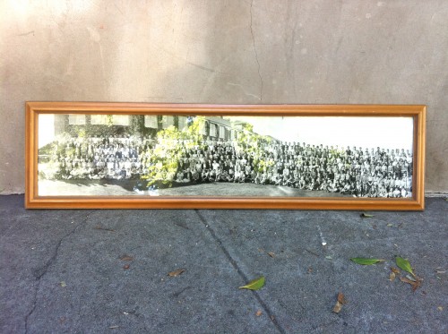 long black & white rectangular photo with lots of people