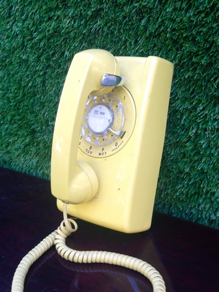 yellow retro wall phone