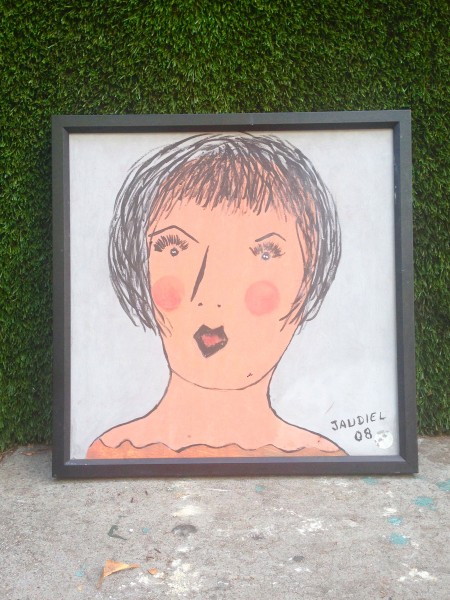 framed sketch of woman with black hair