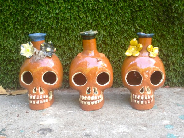 3 skull candleholders