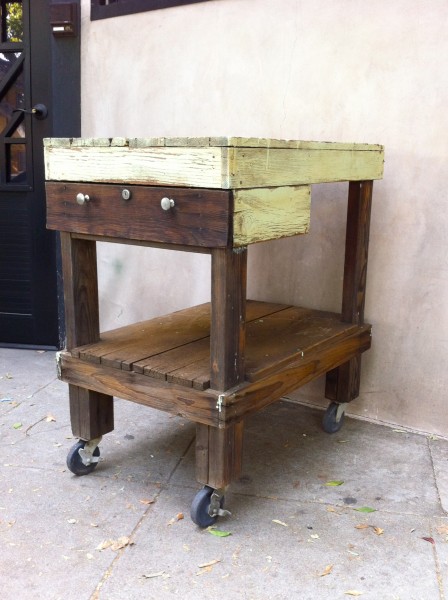 vintage wooden table on wheels