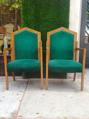 pair of fuzzy green captain chairs