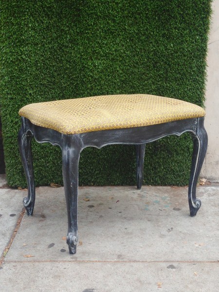 vintage ottoman with pattern upholstery