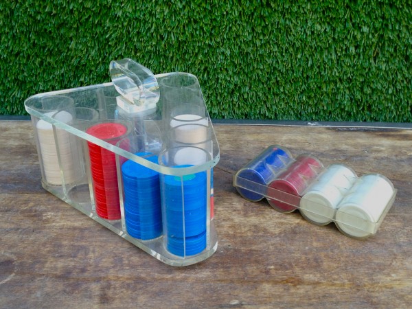 set of vintage poker chips with lucite case