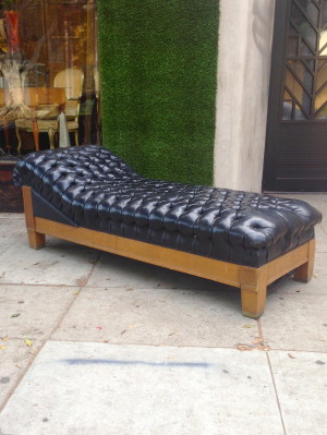 black tufted chaise lounge