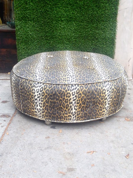 round leopard pattern ottoman on casters