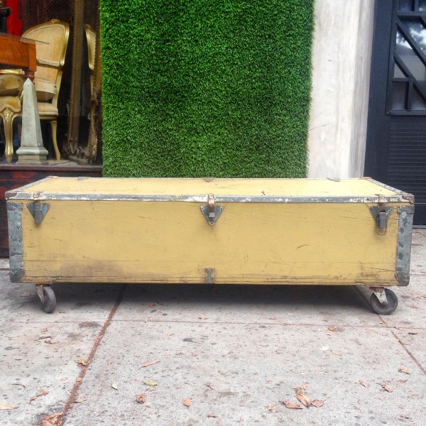 large vintage yellow trunk on casters (great as coffee table)