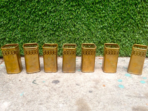 7 small brass vases