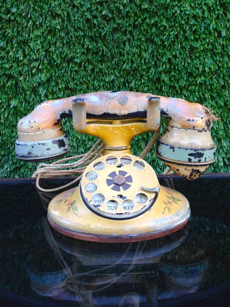 vintage yellowish telephone