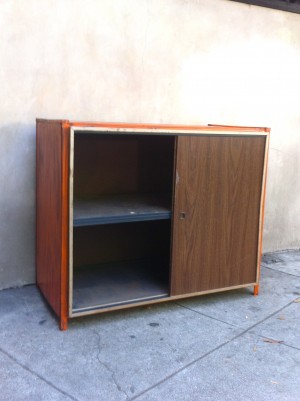 orange retro metal cabinet with sliding doors