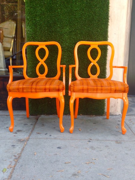 pair of orange accent chairs