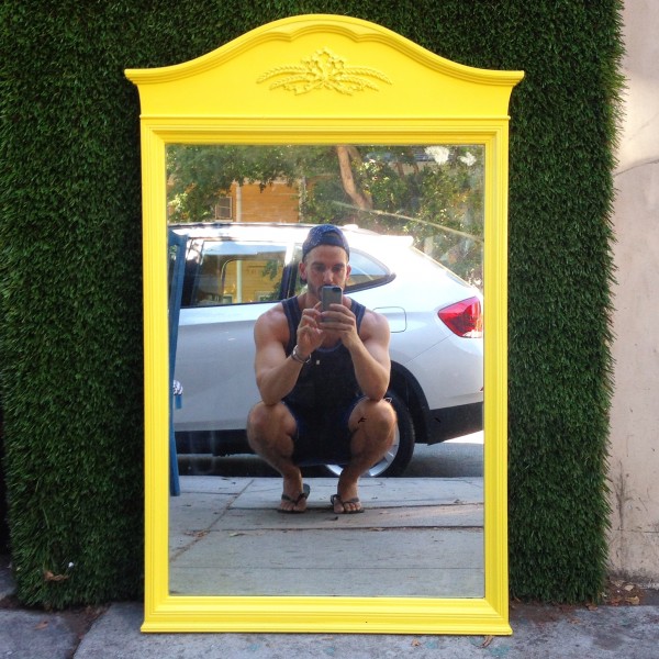 yellow framed mirror