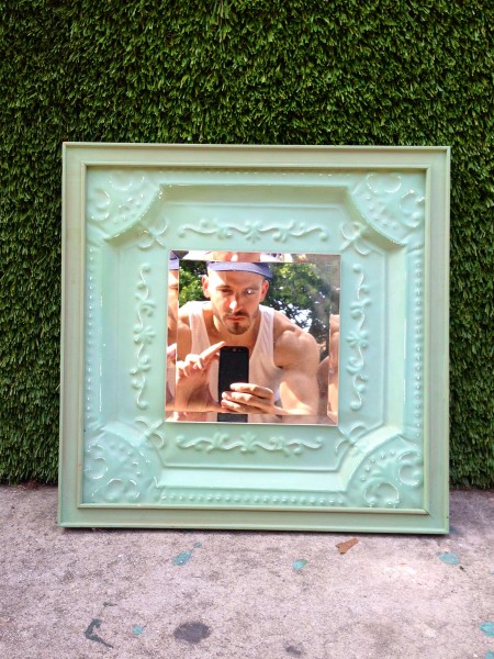 small square green ornate mirror