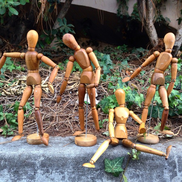 vintage wood figurines on stand