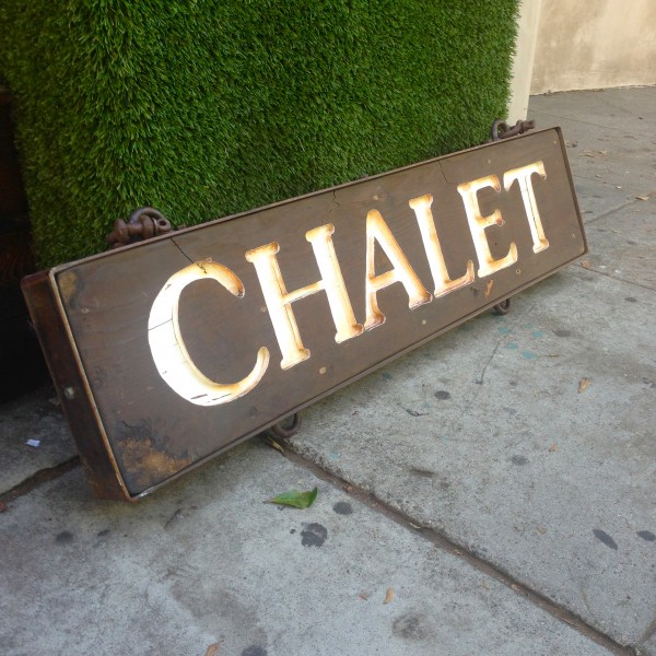 vintage heavy wooden chalet sign with iron frame