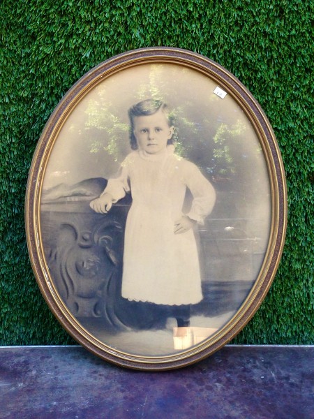 vintage framed photo of kid on white dress
