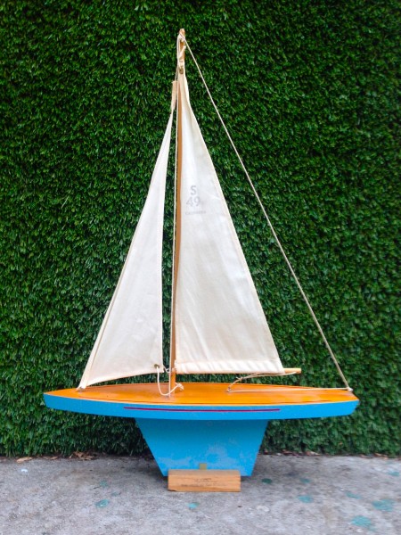 small blue sail boat