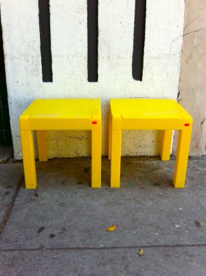 2 plastic yellow end tables
