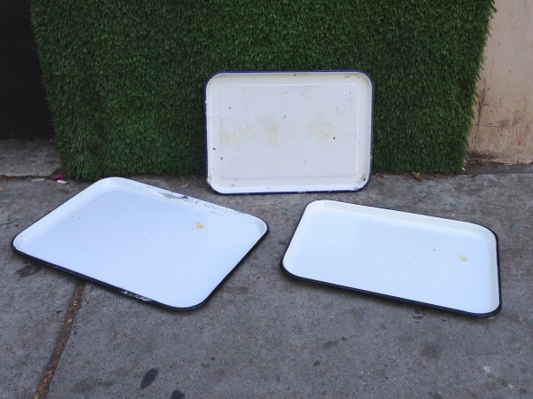 3 white metal trays