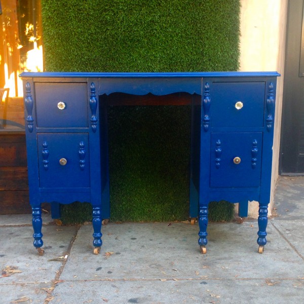 vintage newly painted blue desk with 4 drawers on casters