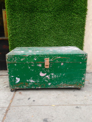 vintage green trunk on wheels