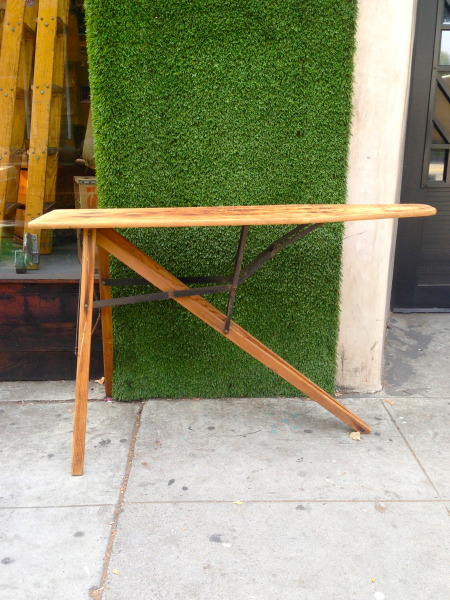 vintage ironing board with metal hardware
