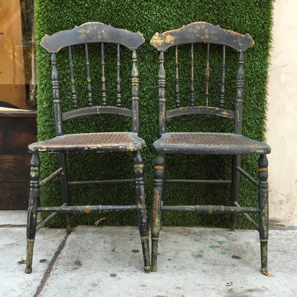 2 distressed wooden chairs