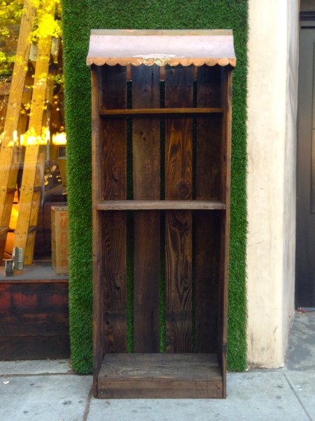 vintage wooden shelving unit with metal awning