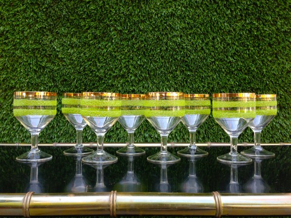 set of vintage glassware with green stripes