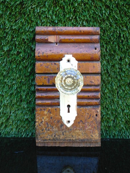 vintage wall hanging glass door knob on wood