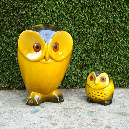2 yellow ceramic owls