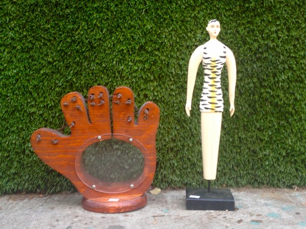 wood baseball glove and man figurine