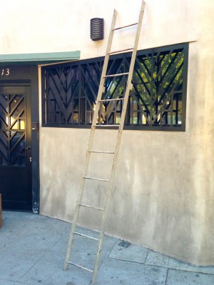 tall vintage metal ladder