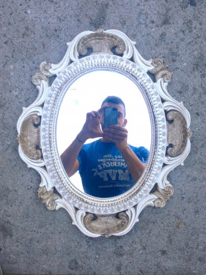 vintage mirror with white and gold ornate wooden frame