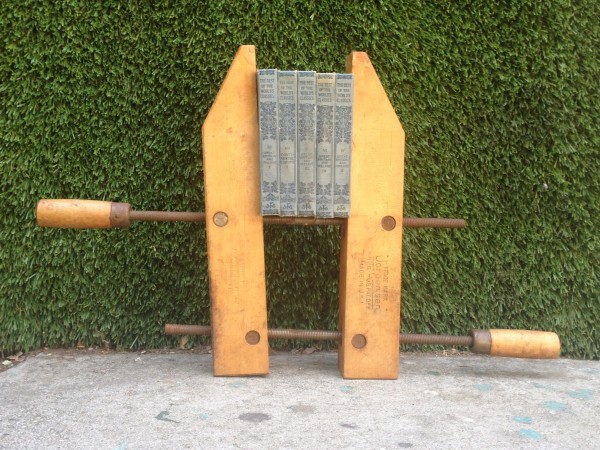 vintage wooden press and set of books
