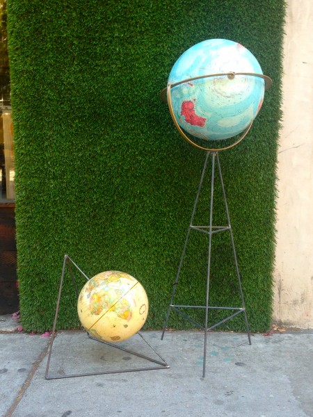 2 vintage globes with iron stands designed by local designer