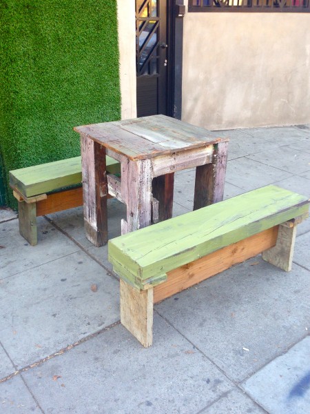 square wooden table with benches