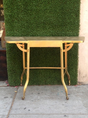 gold metal table with leaves