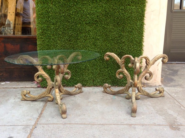 pair of ornate iron end tables (one glass missing)