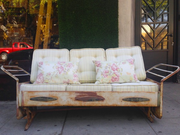 vintage white metal glider with cushions