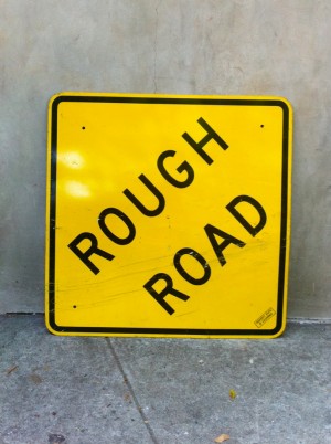 vintage rough road yellow sign