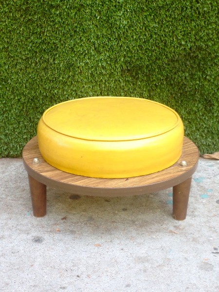round midcentury yellow ottoman